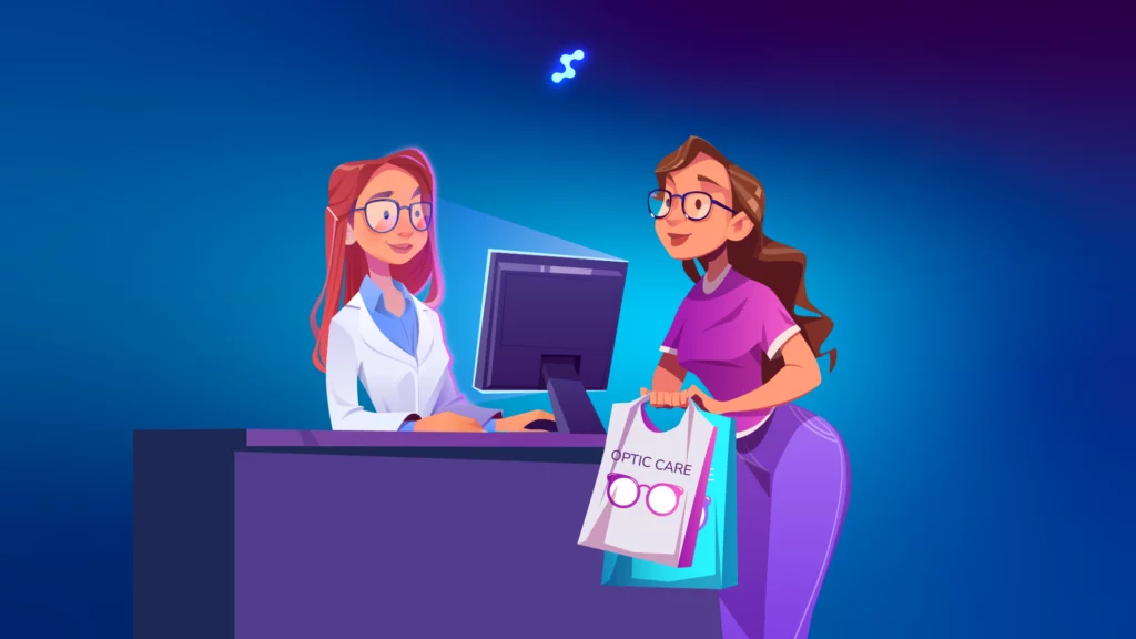 An optician assists a customer buying glasses at the counter
